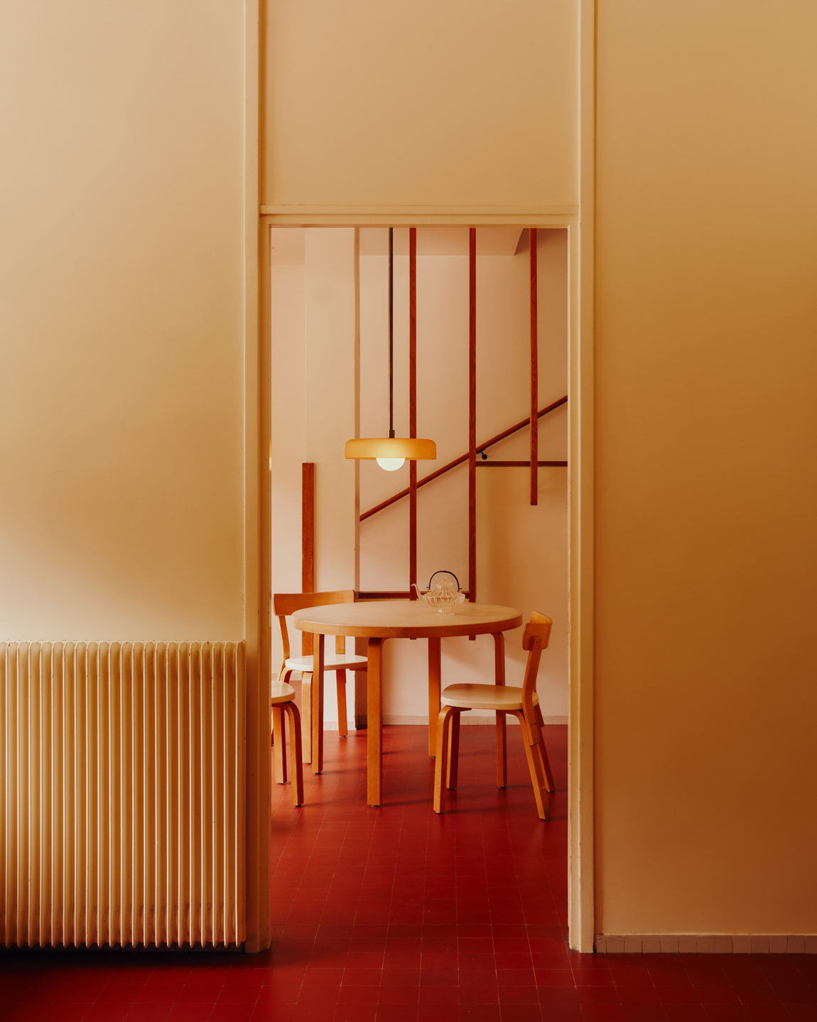 Disc Pendant, Medium // Sandblasted Amber / Patina Brass // Photo by Bastian Achard